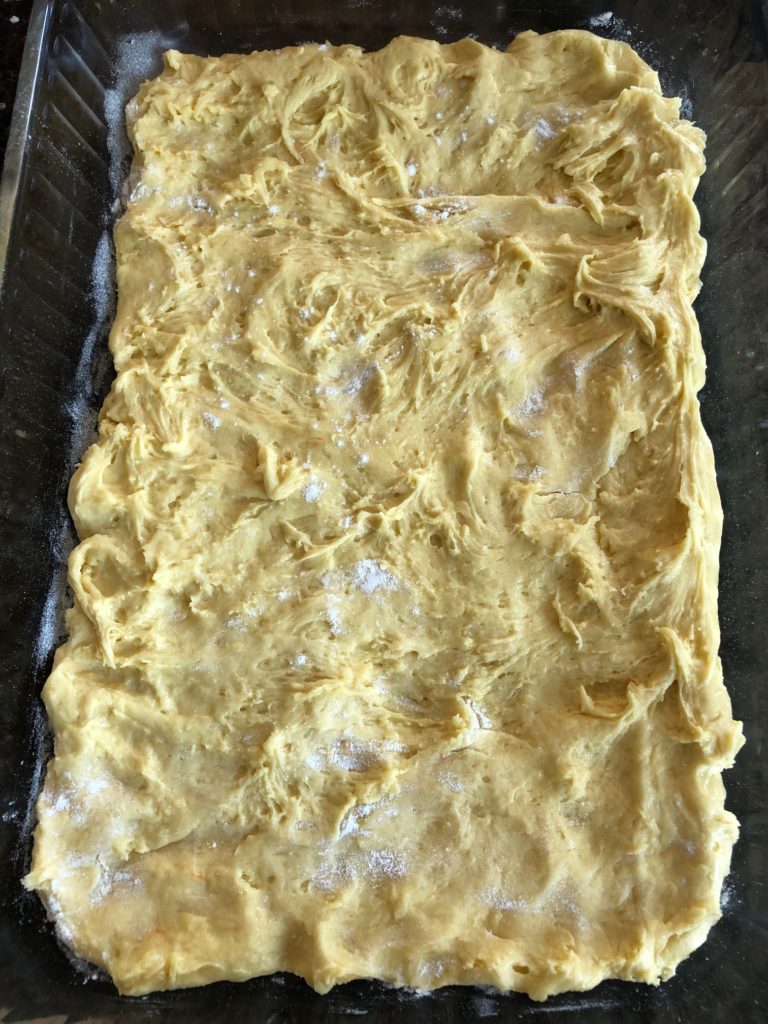 Cake mix added to the 9X13 pan and pat into a single layer