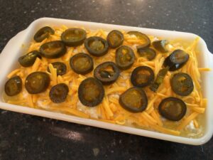 Top with cheese and jalapenos before baking.