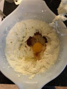 Cream the butter and sugar together with a hand mixer. Beat the egg and vanilla extract into the butter mixture.